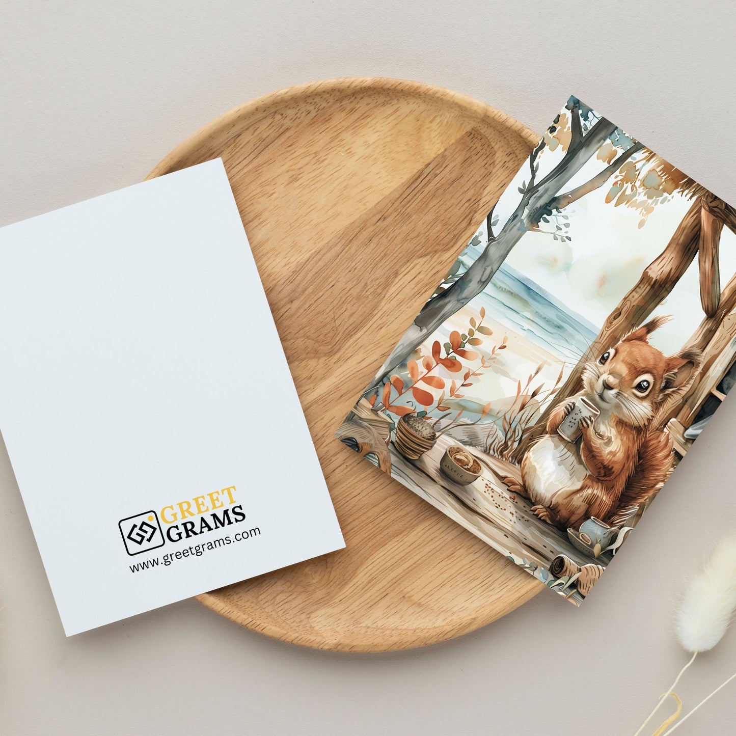 greeting card of a squirrel exploring the beauty of a seaside in the grey background