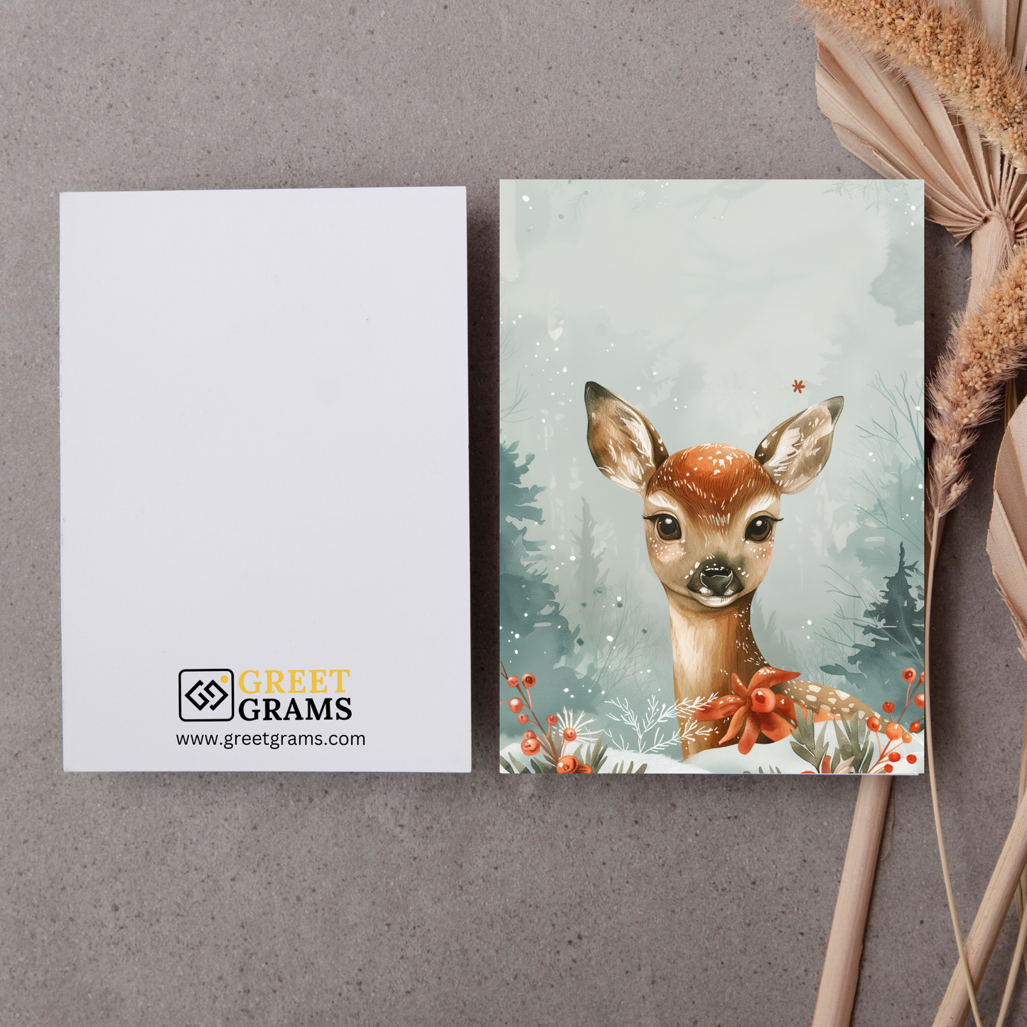 greeting card of a deer in a snowy forest with the grey background