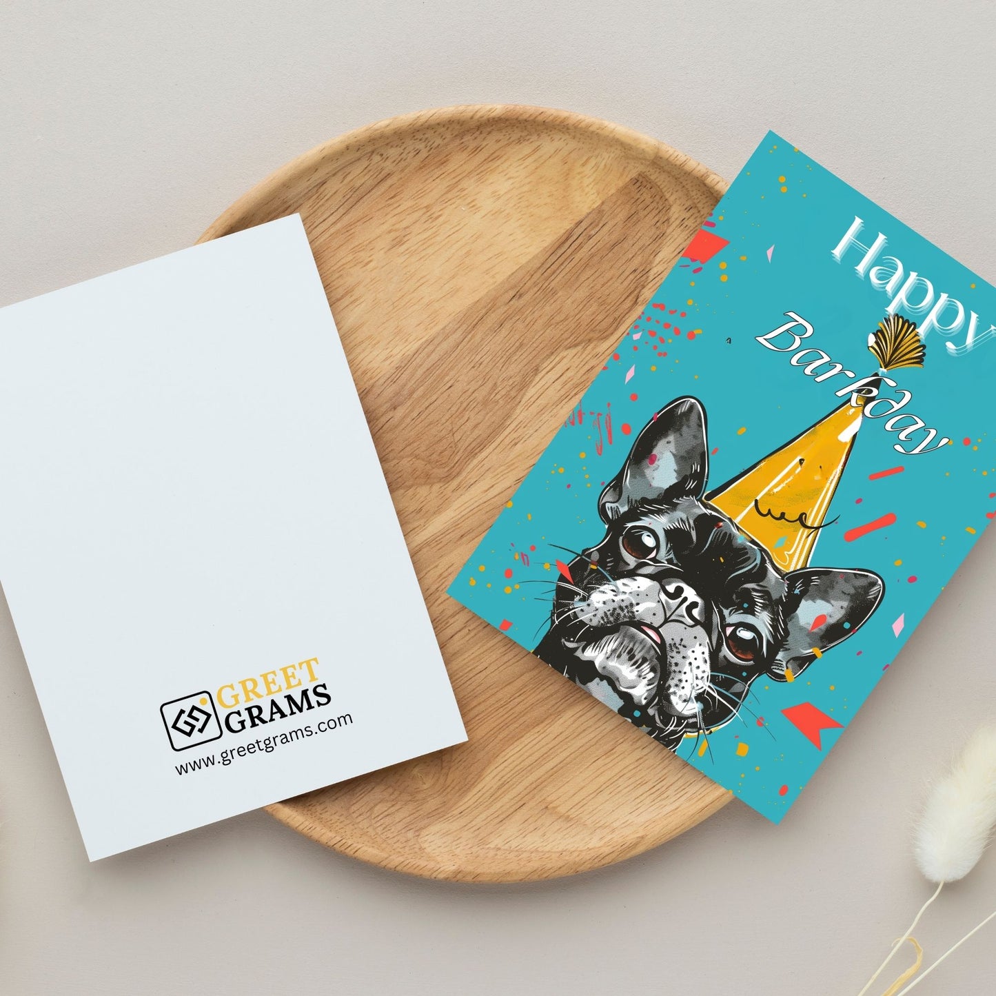 Happy birthday card showing black dog wearing birthday cap