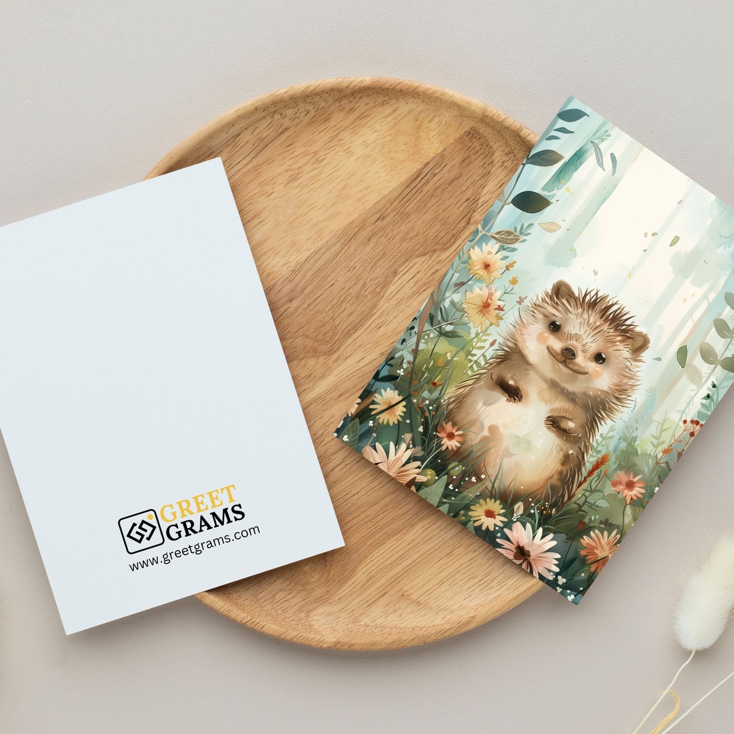 greeting card of a hedgehog surrounded by snow in the gray background hedgehog taking a peaceful stroll at the forest in the grey background