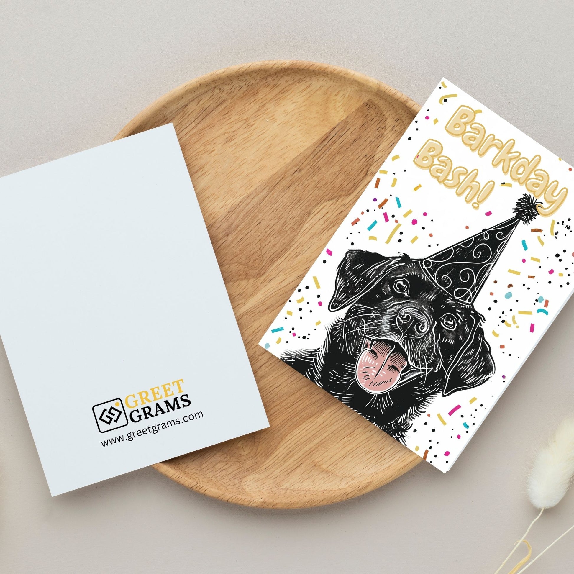 Black Dog wearing black hat in birthday party cards on table