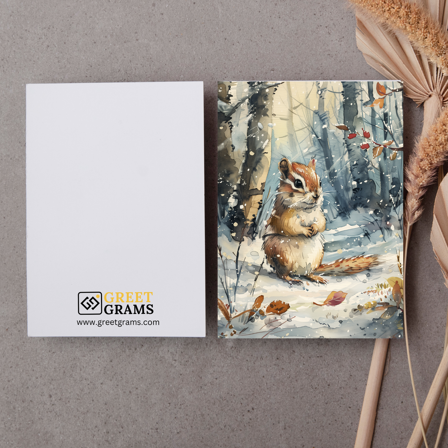 greeting card of a chipmunk in the snow forest in grey background