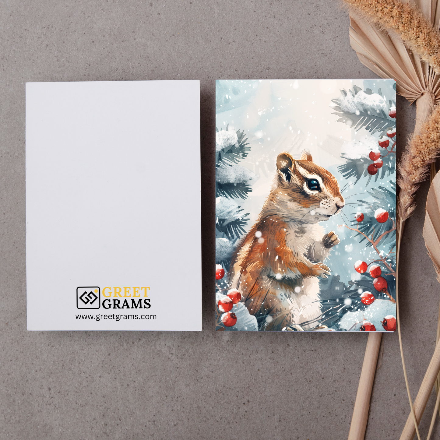 greeting card of a chipmunk exploring the winter wonderland in grey background