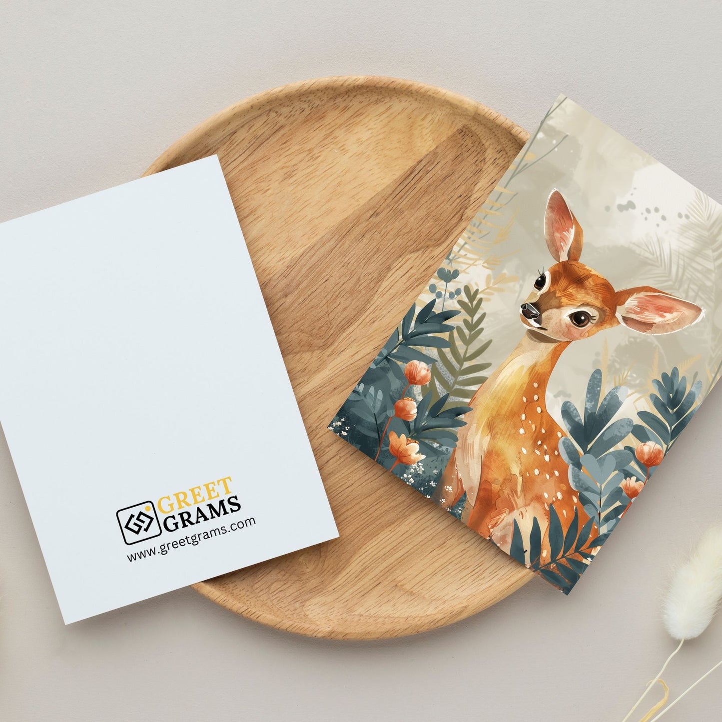 greeting card of a charming deer at tropical paradise in the grey background