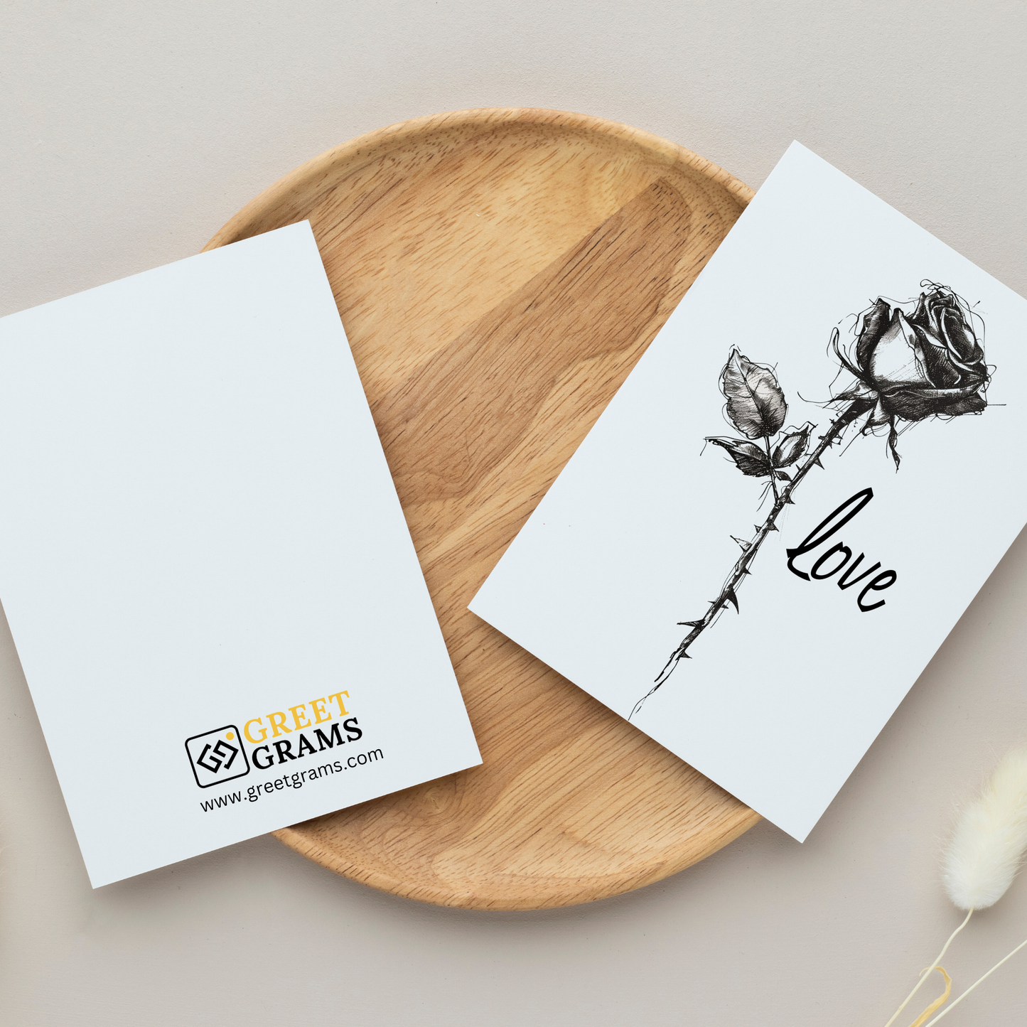  greeting card with a solitary rose  in the grey background