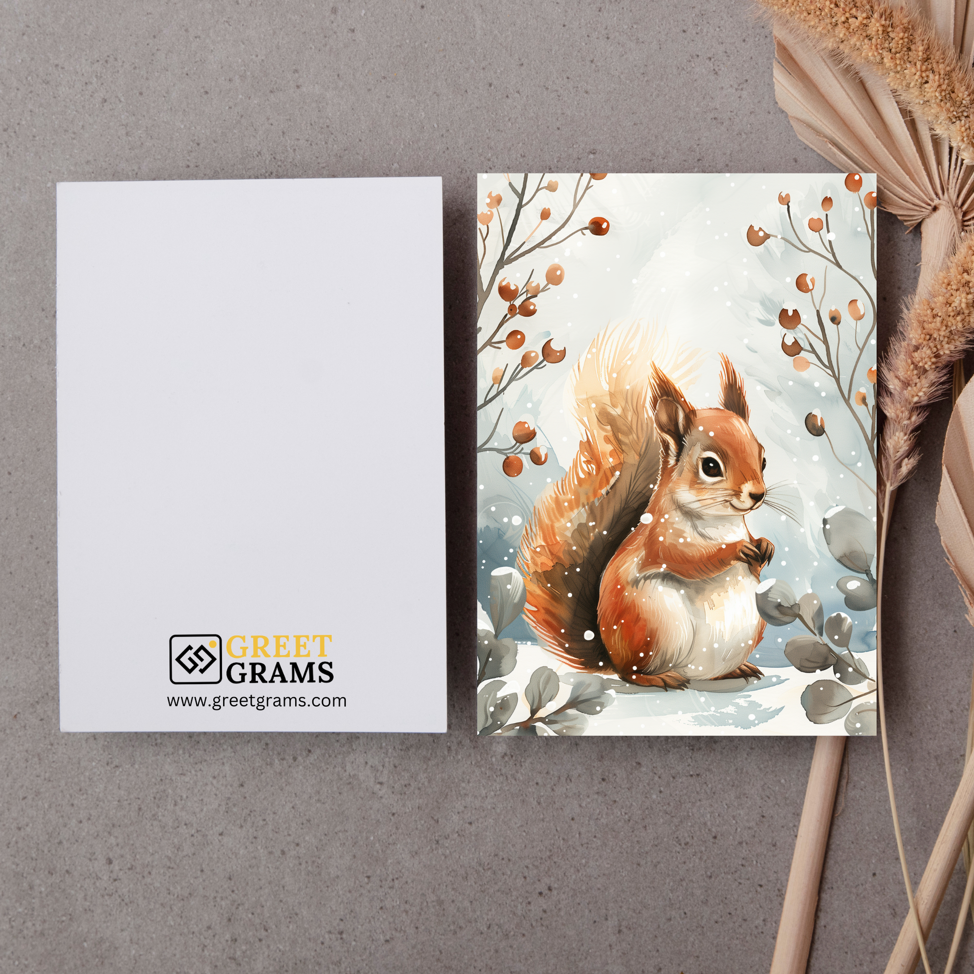 greeting card of a squirrel enjoying the winter wonderland in the grey background