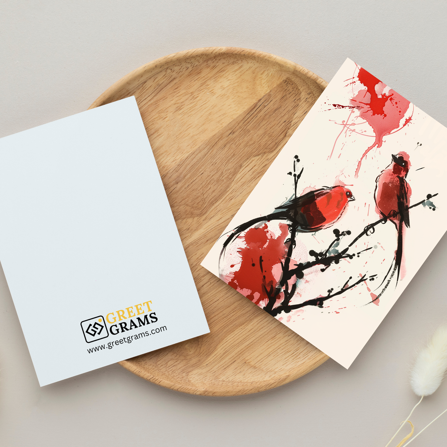 greeting card of  two birds sitting on a branch in the grey background