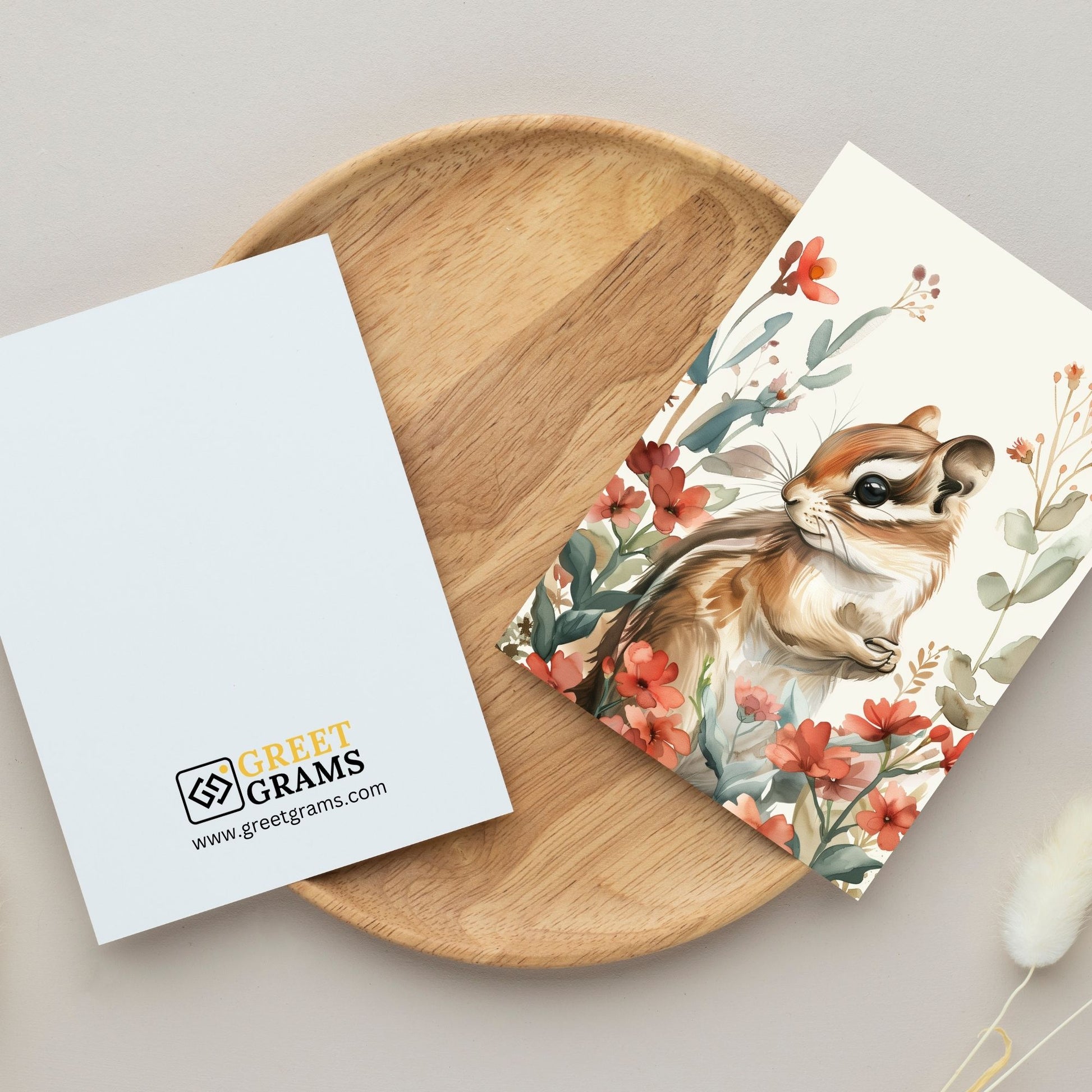 greeting card of a chipmunk exploring a lush tropical paradise in the grey background