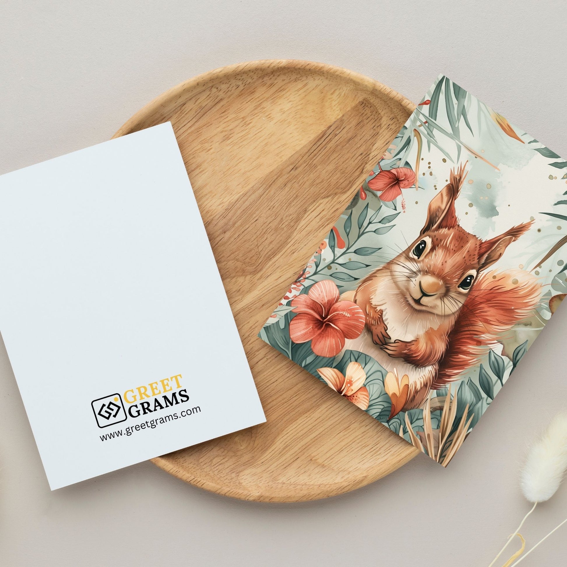 greeting card of a squirrel reveling in the tropical scenery in the grey background