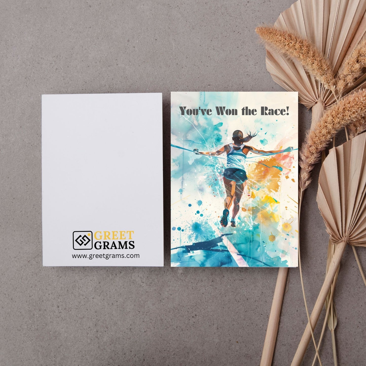 Graduation card showing girl wining race 