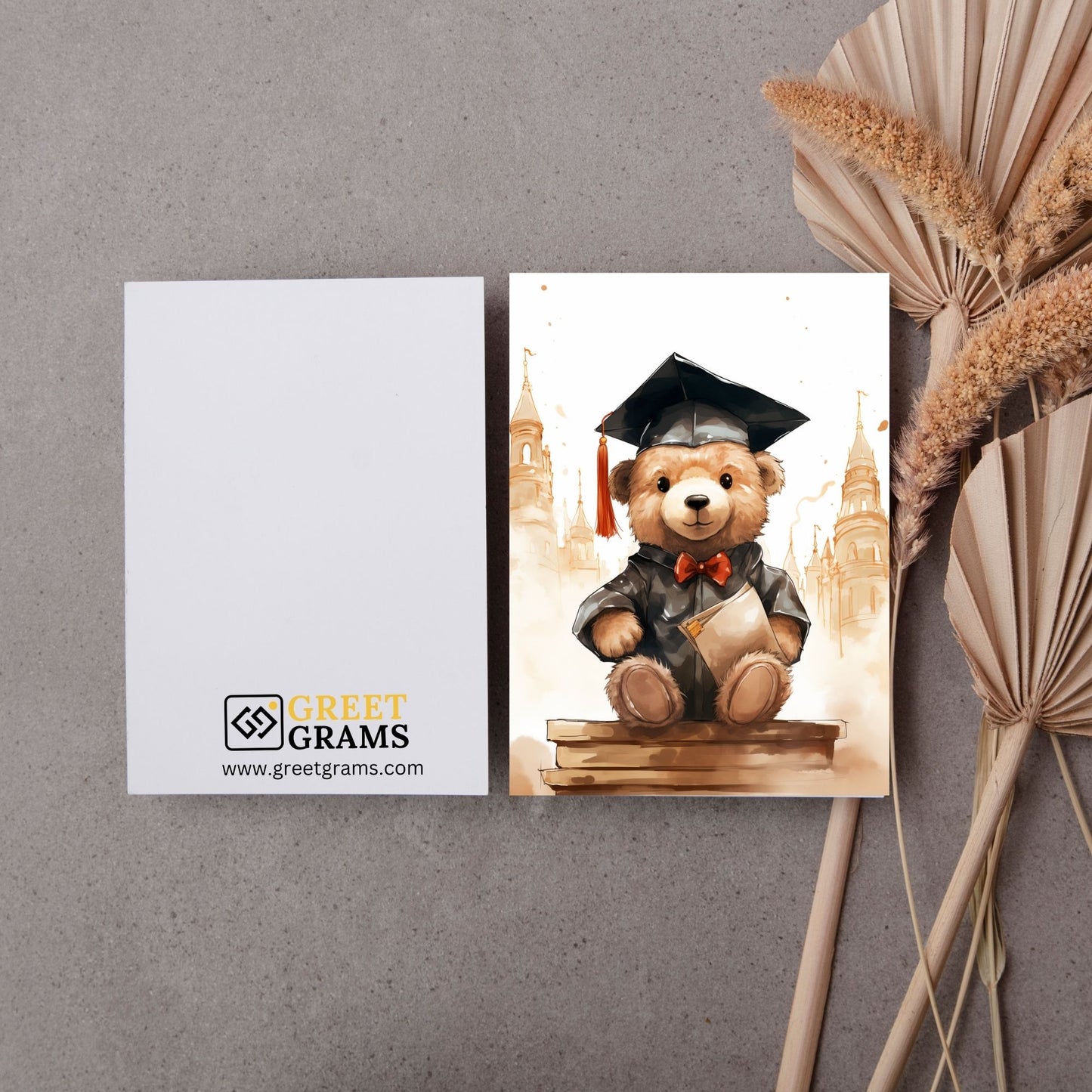 graduation card showing bear wearing black hat and coat front and back