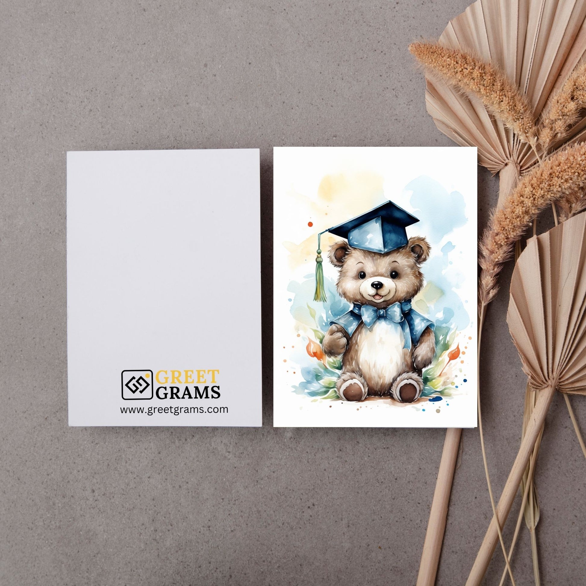 Graduation card showing a bear is smiling and wearing black graduation cap 